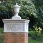 neighborhood marker painted white with brick base