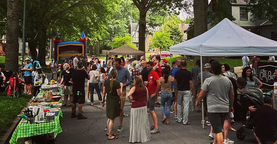 Streetview photo of neighbors enjoying the annual block party